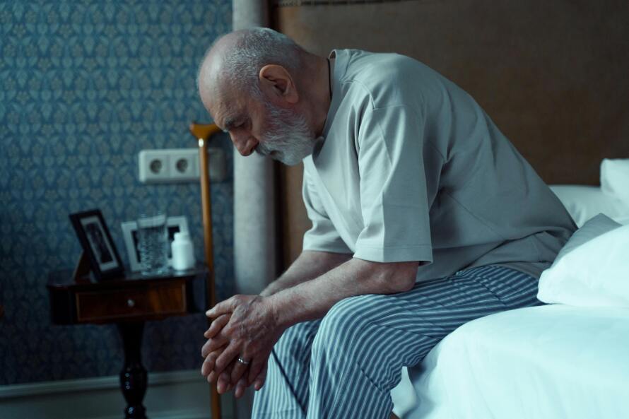 Elderly man with dementia struggling to fall asleep.