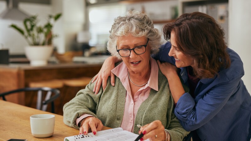 Senior, couple and drinking coffee with a love, marriage and happiness morning mindset at home. Happy smile and hug of a elderly woman and man with tea in a house kitchen together with quality time